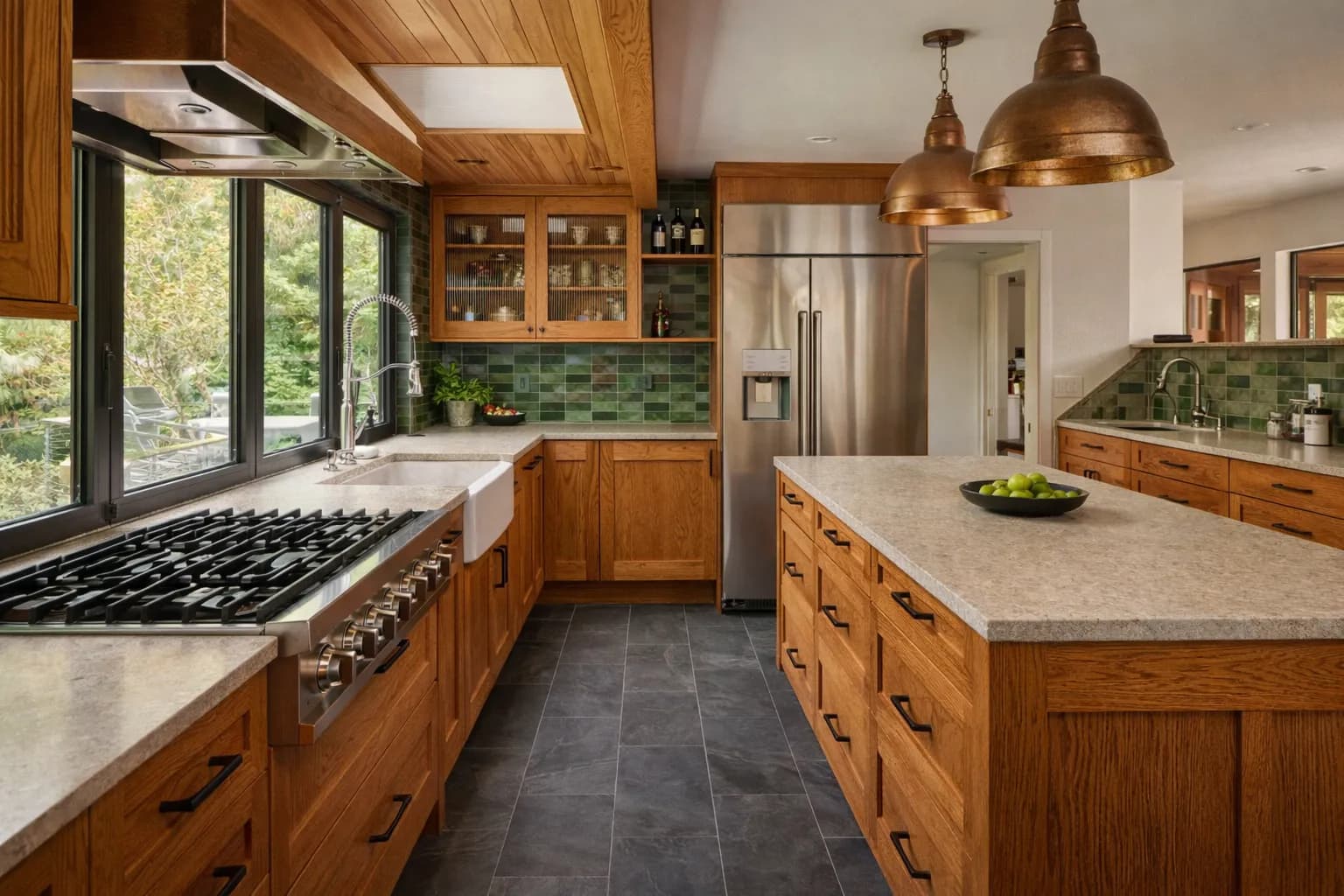 Craftsman-style kitchen with rich wood cabinetry, natural stone counters, and warm pendant lighting in a Seattle bungalow
