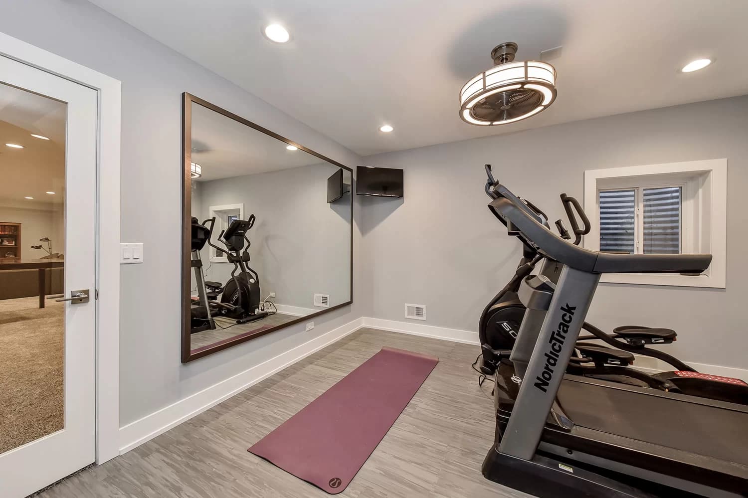 Basement home theater with tiered seating and built-in surround sound