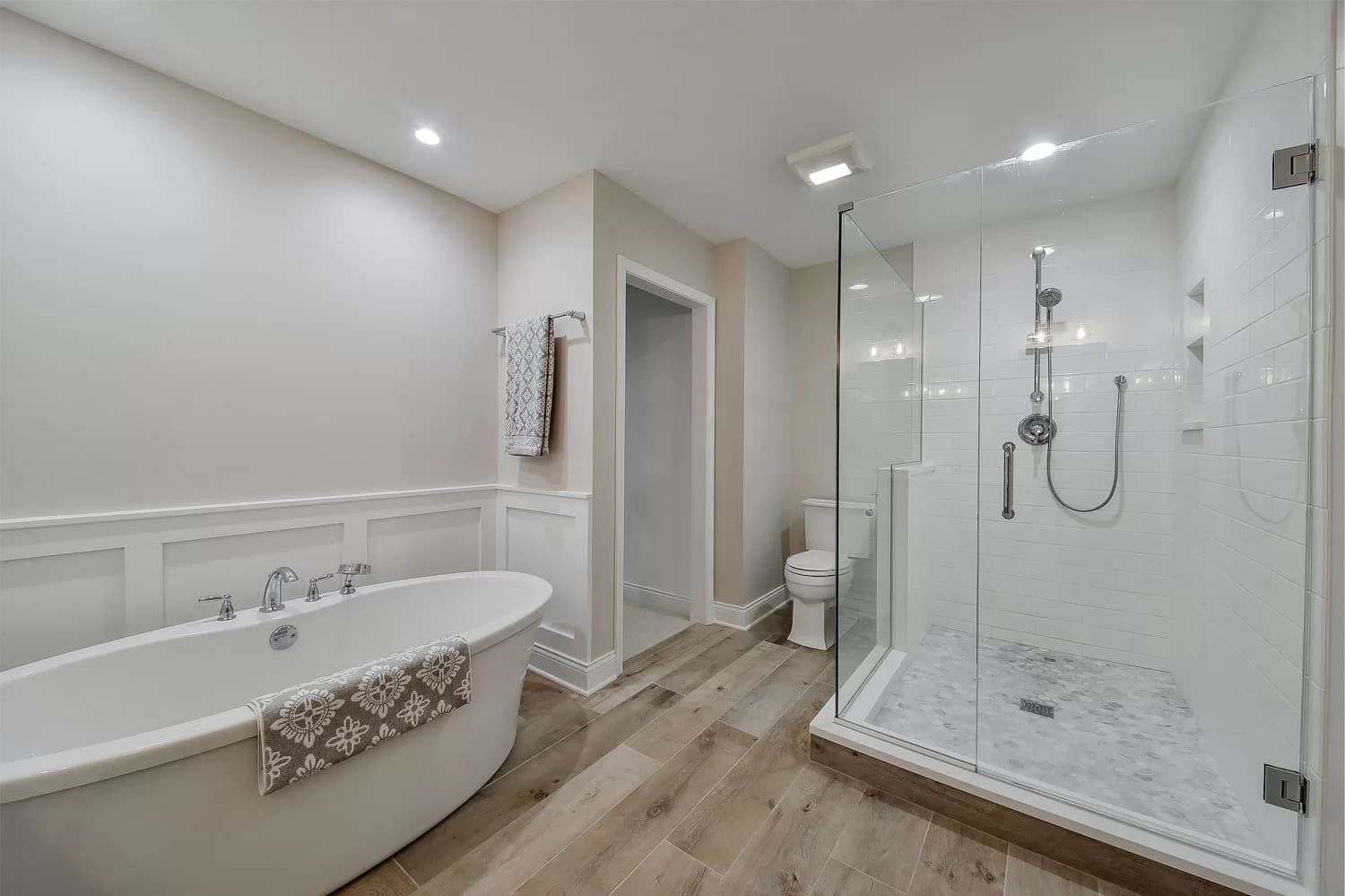 Contemporary double vanity with quartz countertop and backlit mirror