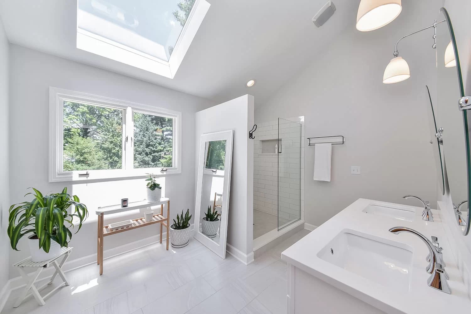 Transitional bathroom with Shaker-style vanity and subway tile walls