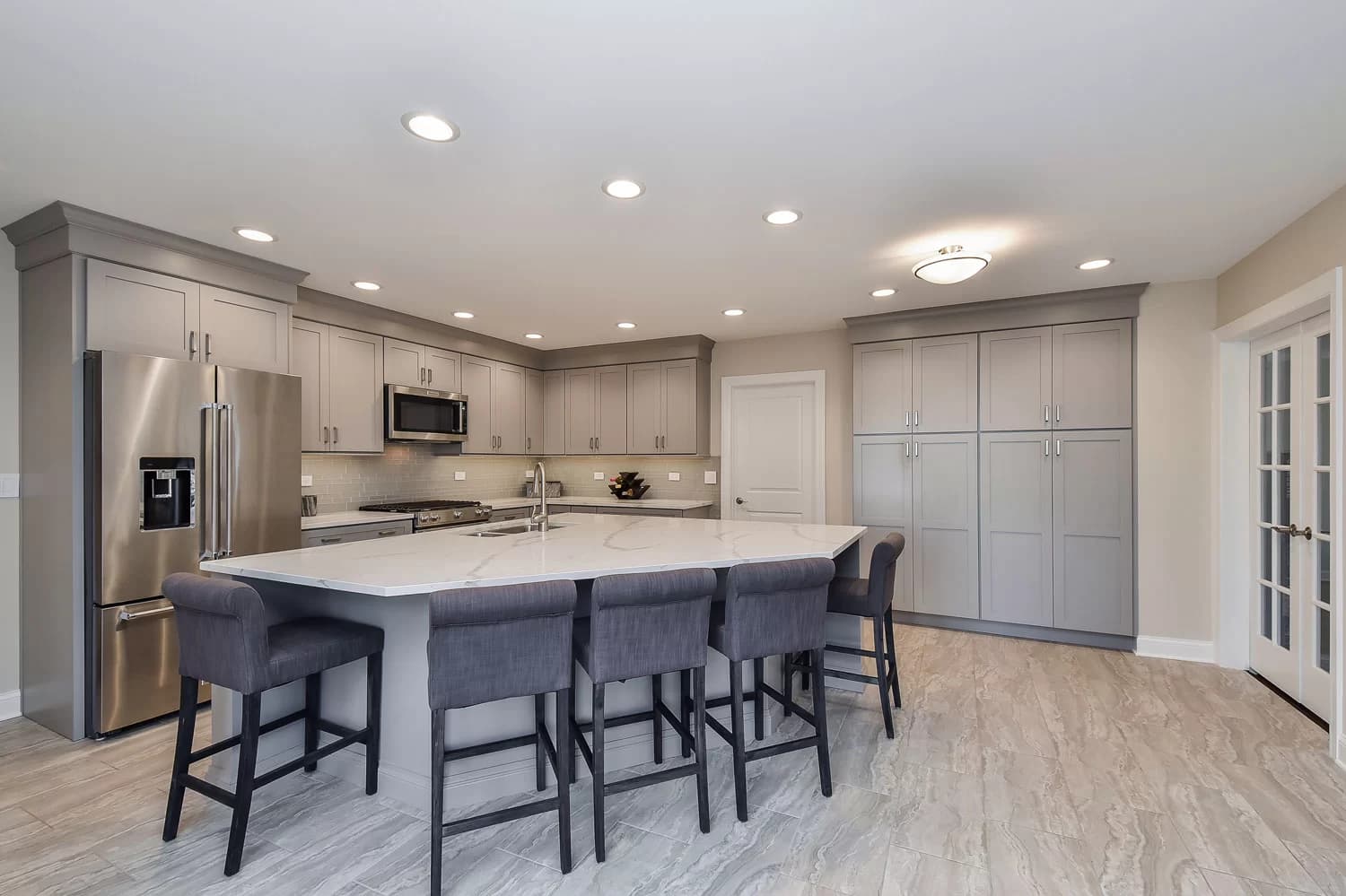 Transitional kitchen with Shaker cabinets and subway tile backsplash