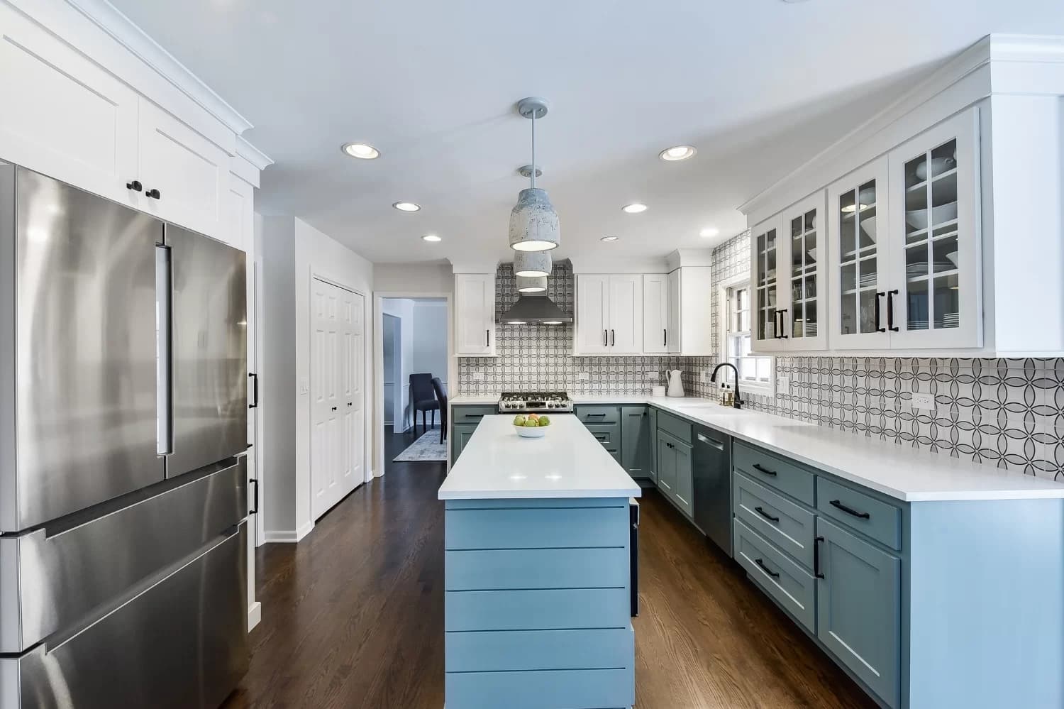 Elegant kitchen remodel with waterfall countertop island