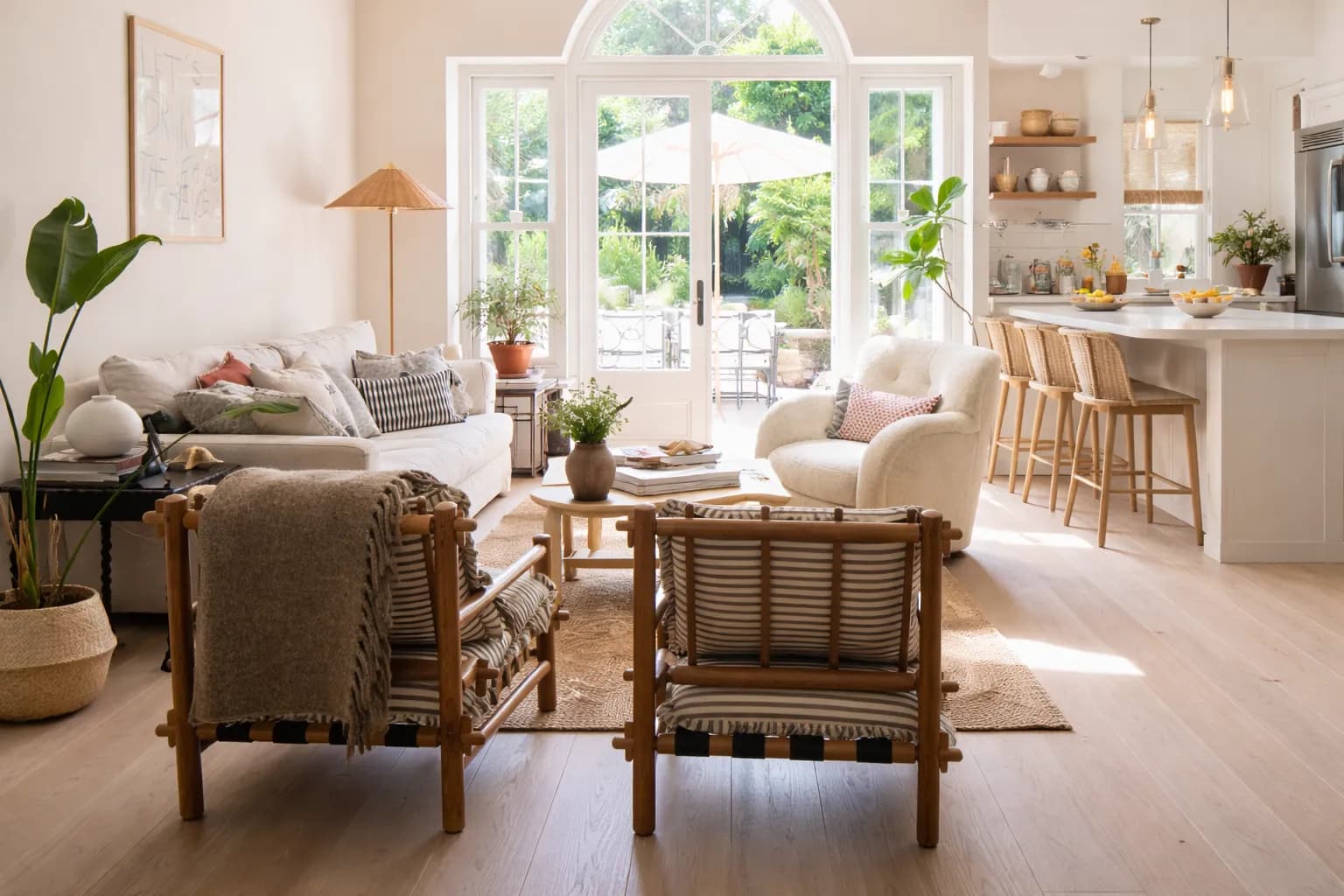 Open-concept backyard apartment interior with modern kitchen and living room